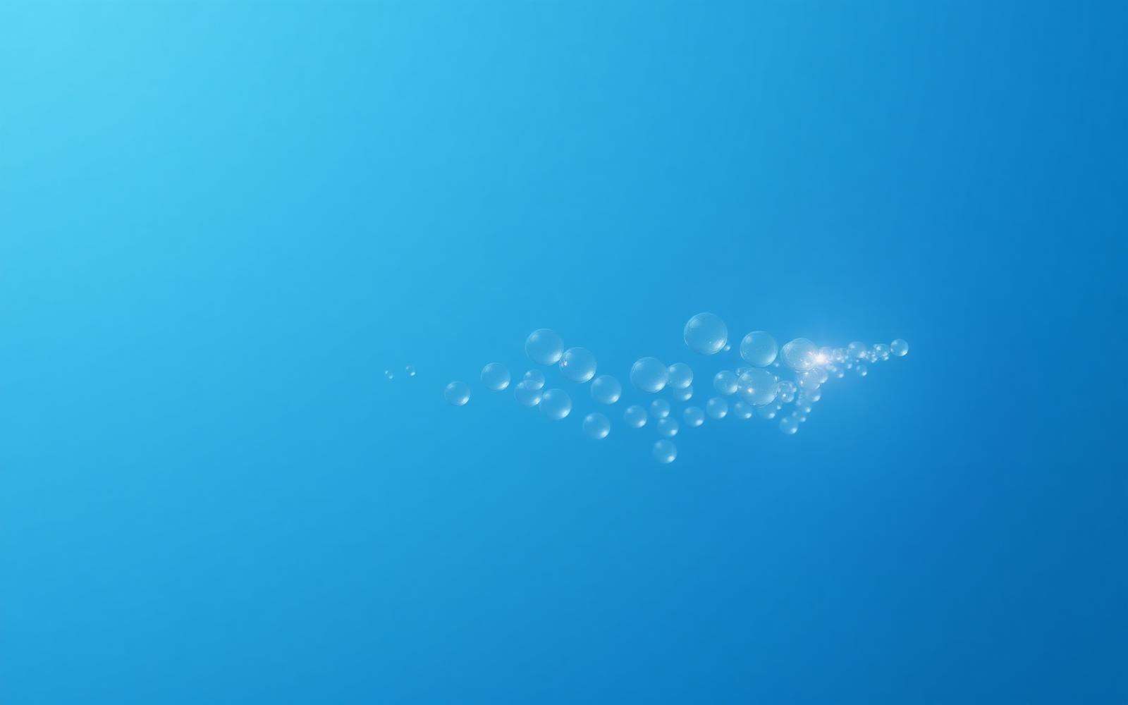 Tiny luminous spheres suspended in pale blue liquid